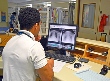 team member studying X-ray