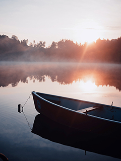 Boat on a lake at sunrise