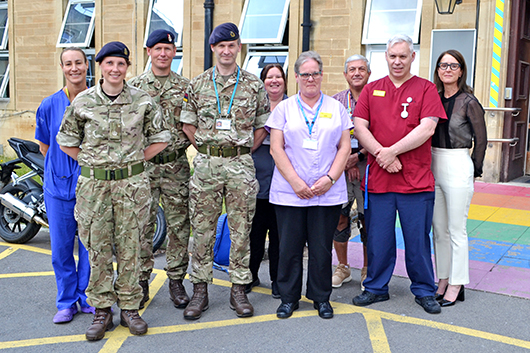 Members of the military with Cara Charles-Barks at the RUH